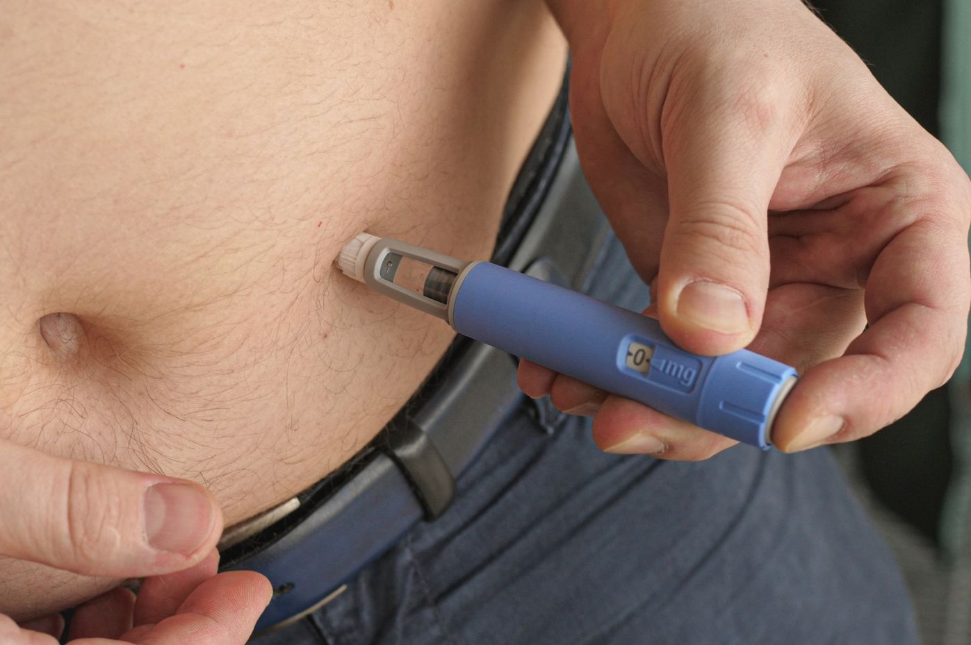 a man getting his Tirzepatide injection for weight management